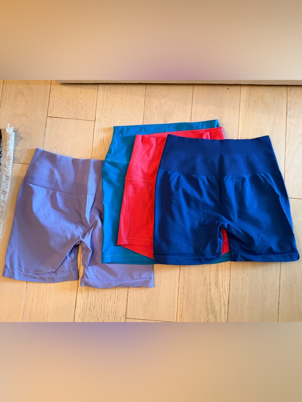 Set of Four Active Shorts in Blue, Teal, Red, and Lavender